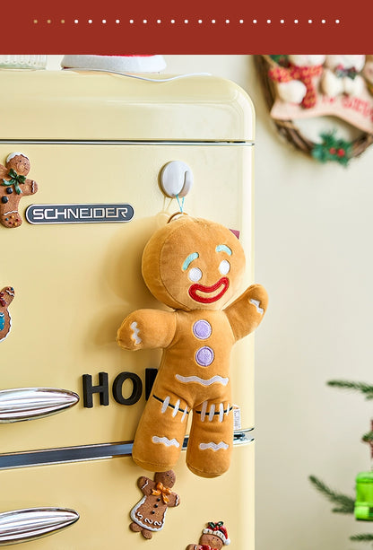 Plush gingerbread man toy attached to a vintage-style refrigerator with 'Schneider' branding.