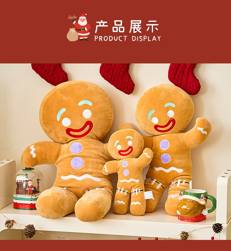 Three plush gingerbread man toys on a shelf with Christmas decorations.
