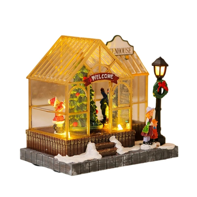 Decorative miniature greenhouse with lights and figures on a white background