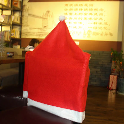 Red Santa hat on a chair in a restaurant setting with a blurred background