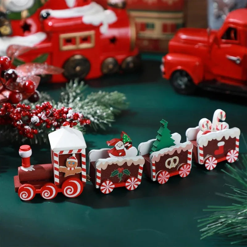 Decorative Christmas train set with Santa Claus figure on a green surface with festive decorations.
