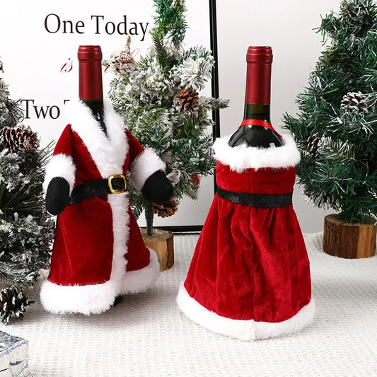 Two wine bottles in Santa Claus costumes with Christmas trees in the background.