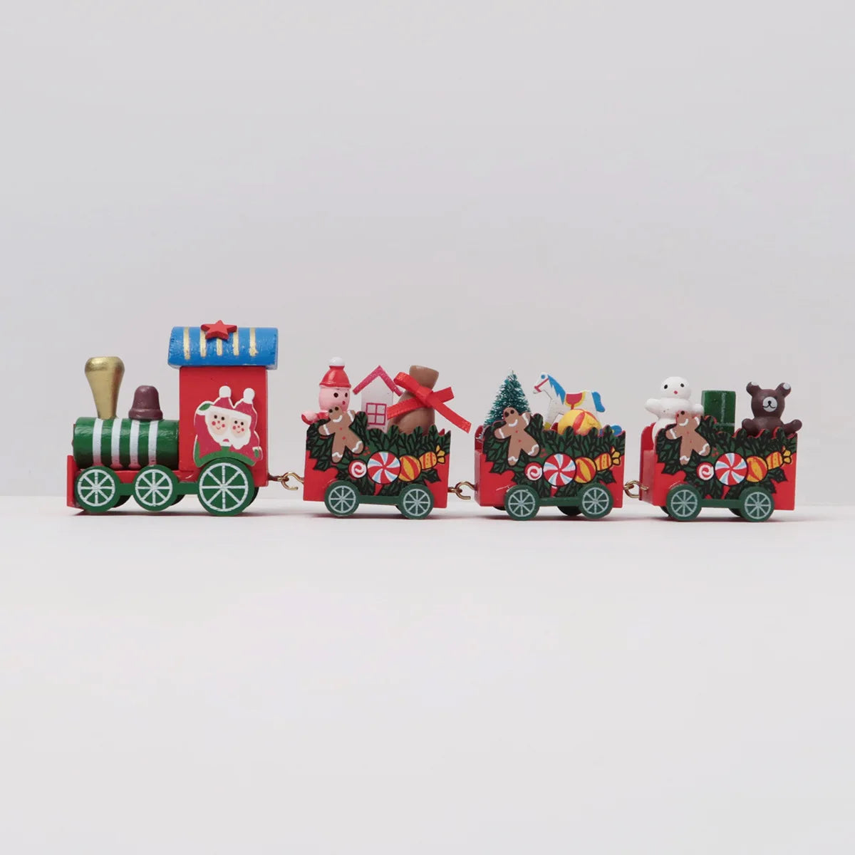 Decorative train set with cartoon characters and Christmas-themed carriages on a white background