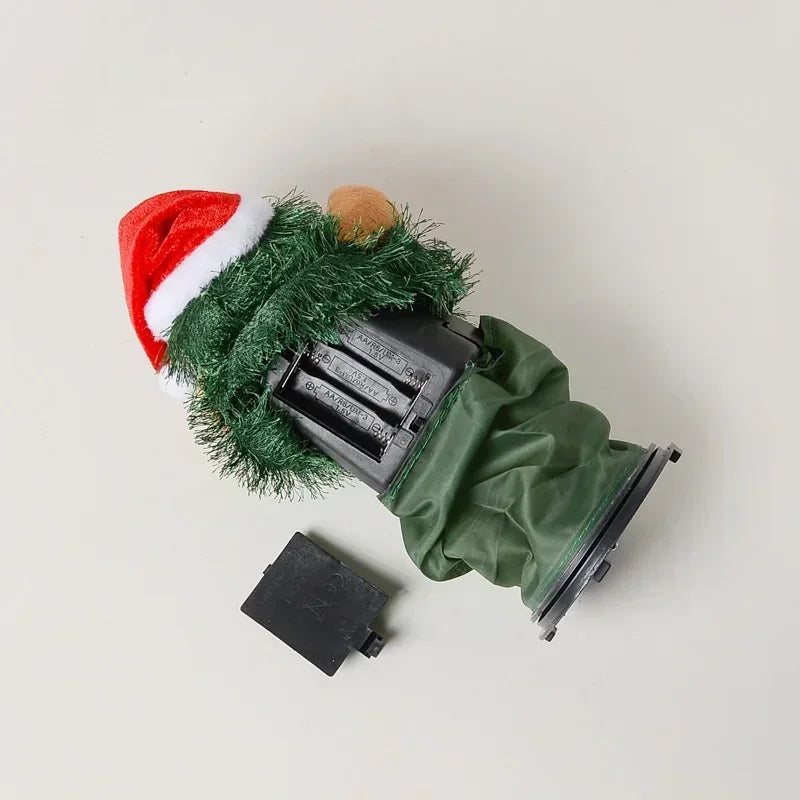 Toy truck with Christmas tree and Santa hat on a light gray background