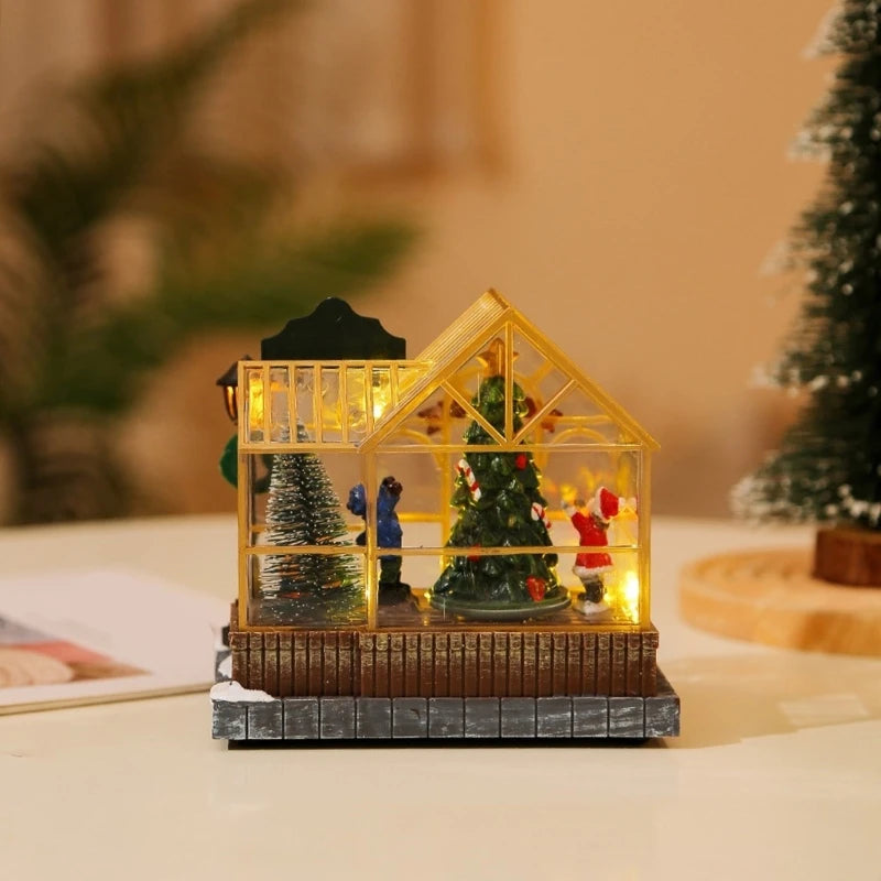 Decorative miniature house with Christmas trees and figures on a blurred background