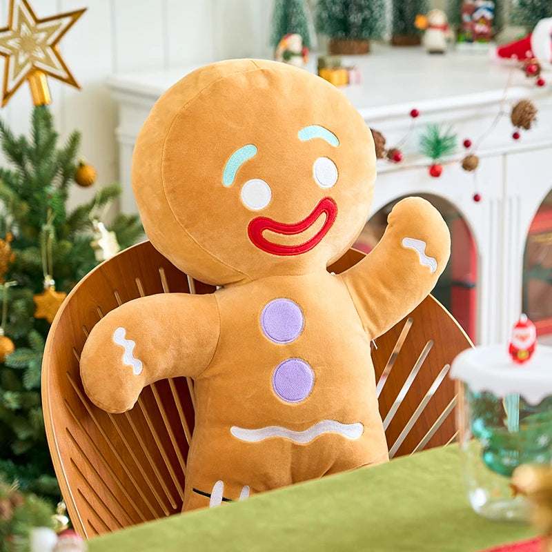 Plush gingerbread man toy sitting on a chair in a festive room with Christmas decorations.