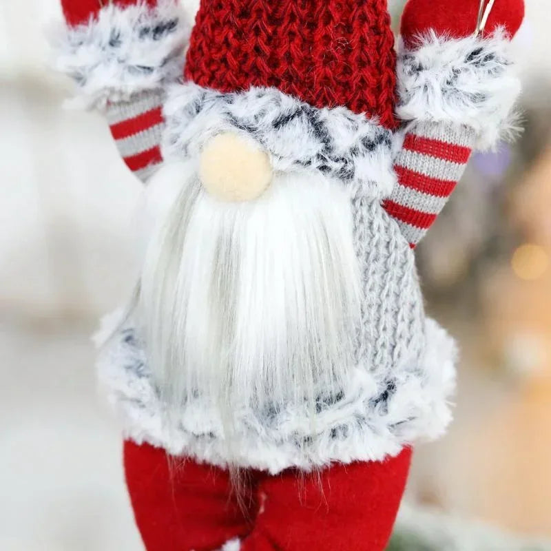 Decorative gnome with red and white striped hat and pants on a blurred background
