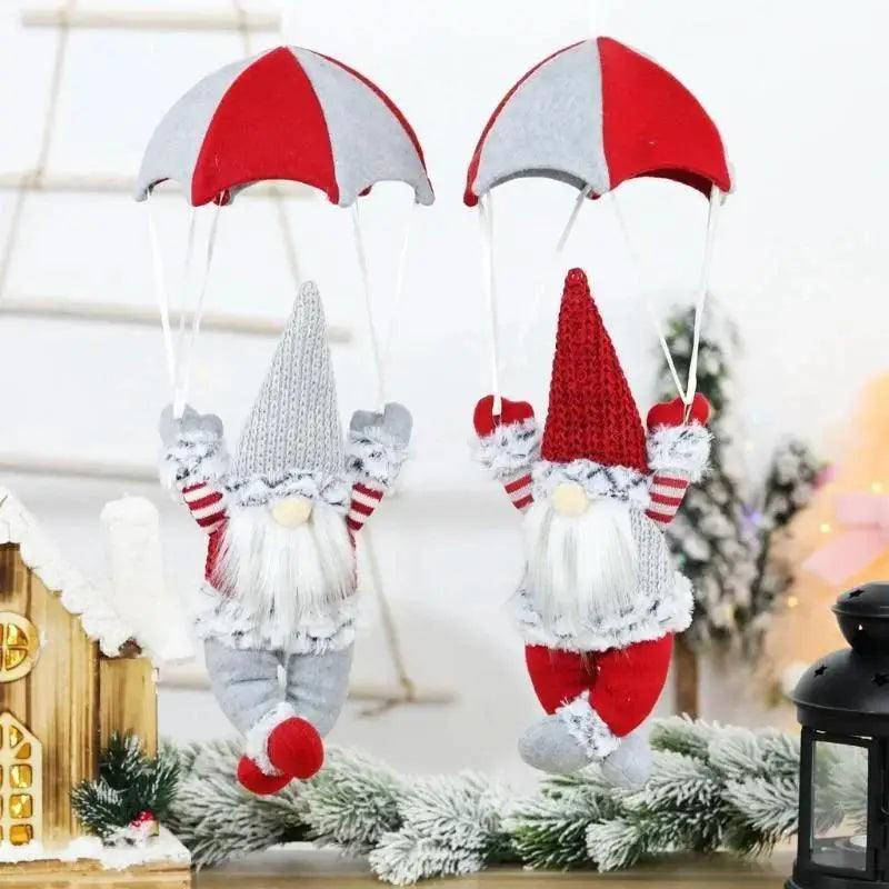 Two decorative gnomes with red and white hats on a Christmas-themed background.