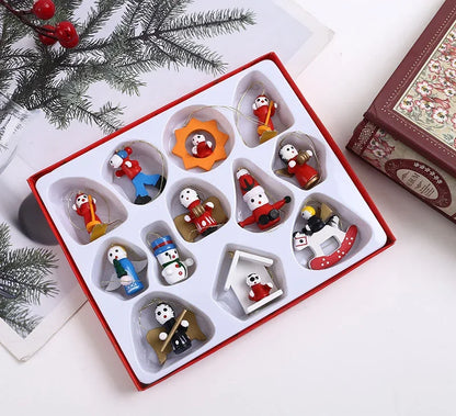 Set of Christmas-themed figurines in a decorative box with festive background