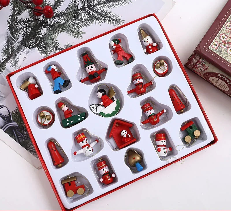 Set of Christmas-themed figurines in a decorative box with a festive background.