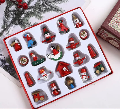 Set of Christmas-themed figurines in a decorative box with a festive background.