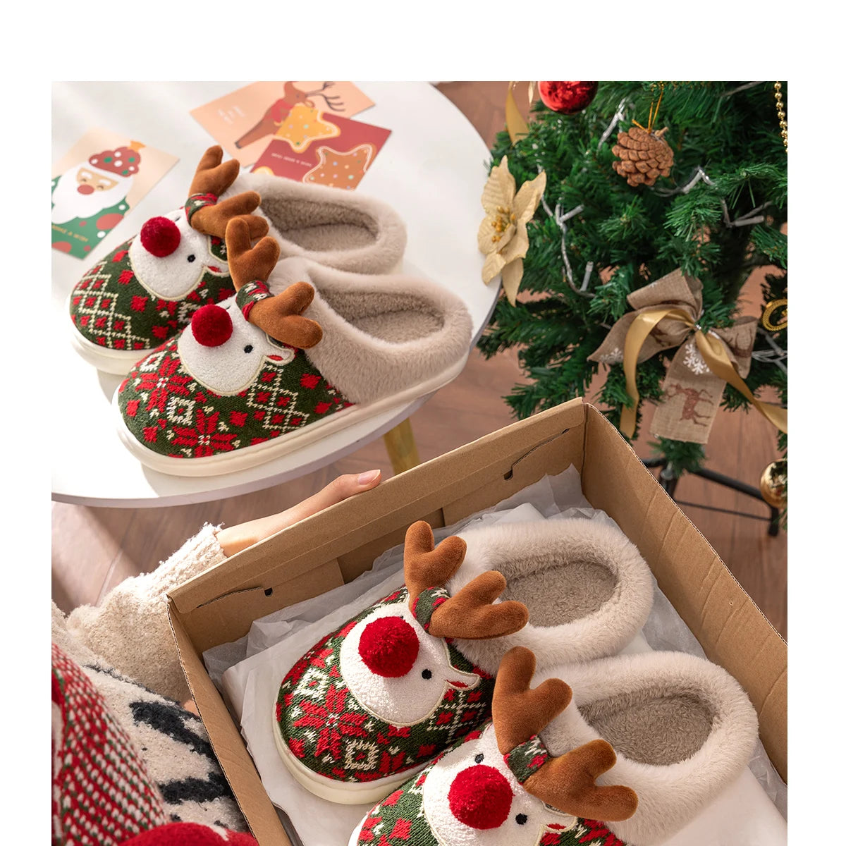 Christmas-themed slippers with reindeer design in a box, next to a decorated Christmas tree.