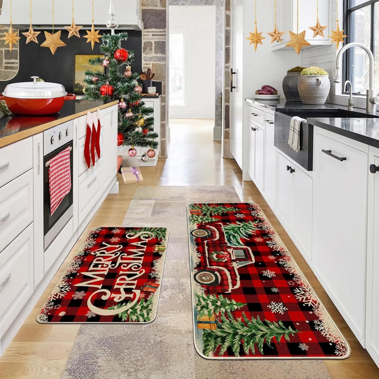 Kitchen with Christmas-themed rugs featuring a red truck and 'Merry Christmas' text.