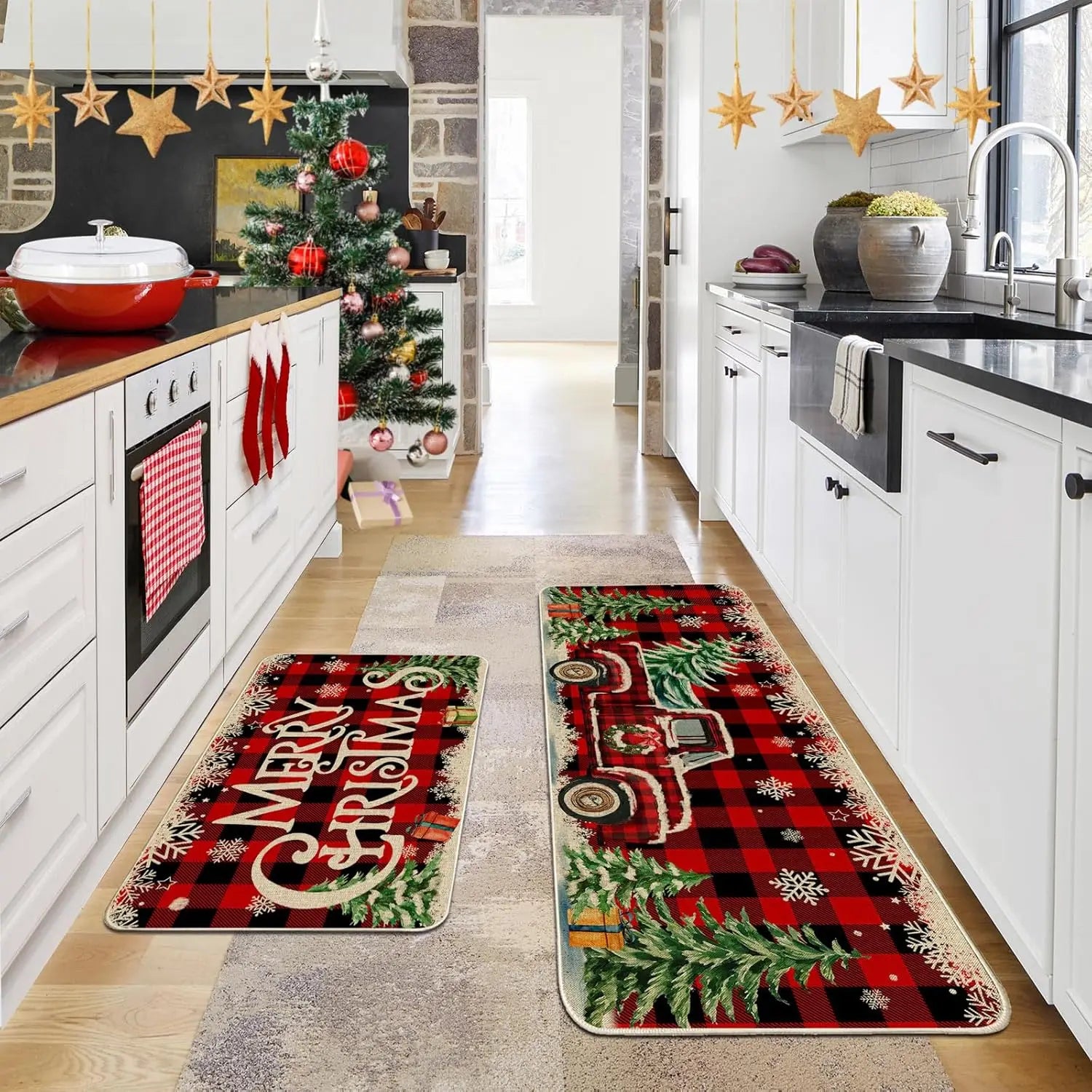 Kitchen with Christmas-themed rugs featuring a red truck and 'Merry Christmas' text.