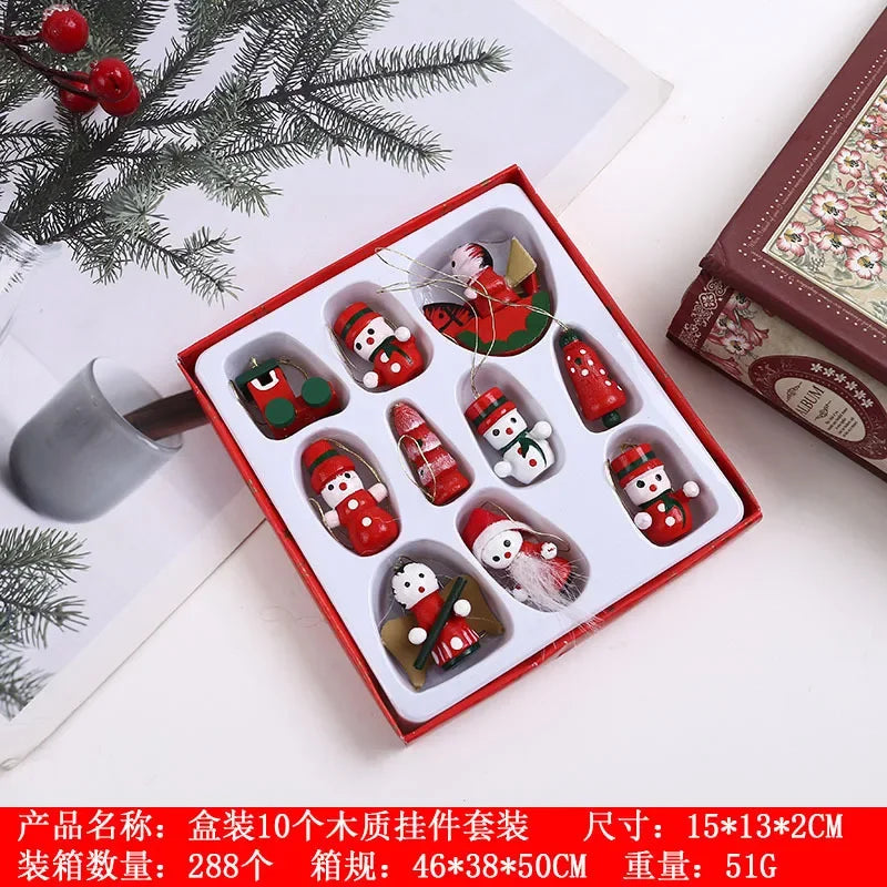 Set of Christmas-themed wooden ornaments in a box with decorative elements on a white surface.
