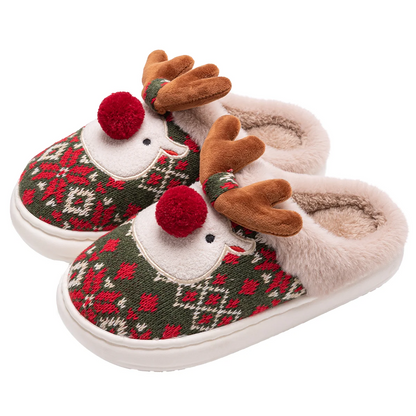 Pair of reindeer-themed slippers with patterned design and pom-pom details on a white background