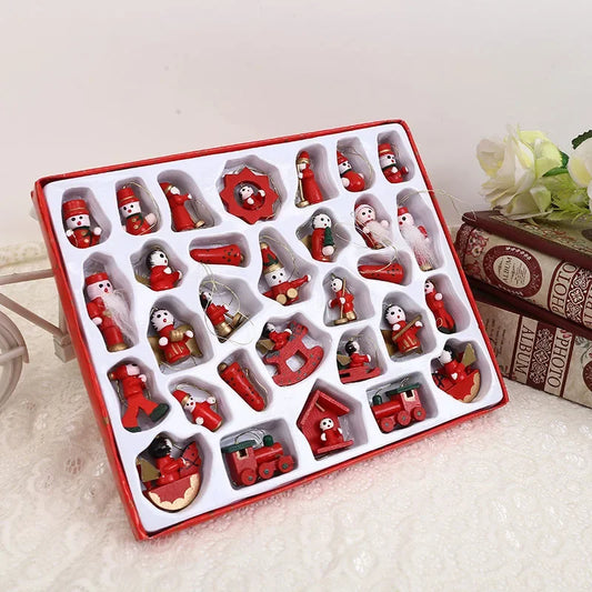 Set of red Christmas-themed ornaments in a box on a light surface.