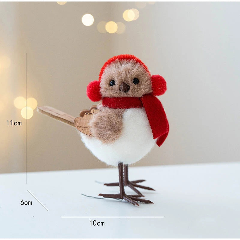 Stuffed bird toy with a red hat and scarf, standing on a white surface with a blurred light background.