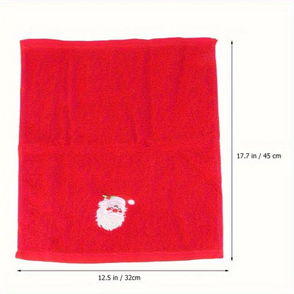 Red towel with a white Santa Claus face design and measurements on a white background