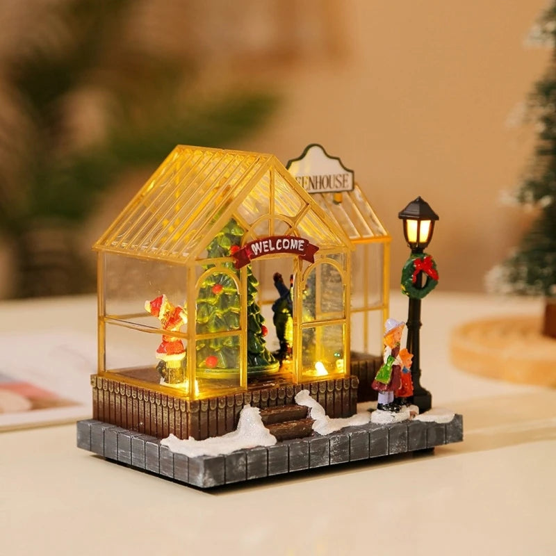 Decorative miniature greenhouse with lights and Christmas-themed elements on a blurred background