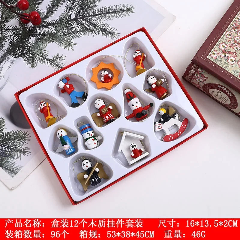 Set of small wooden figurines in a decorative box with Christmas-themed elements.